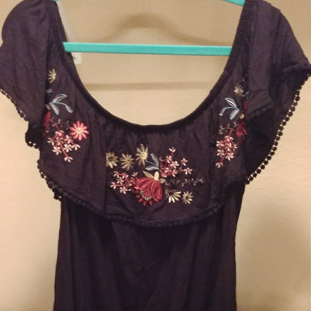 Black embroidered off the shoulder shirt